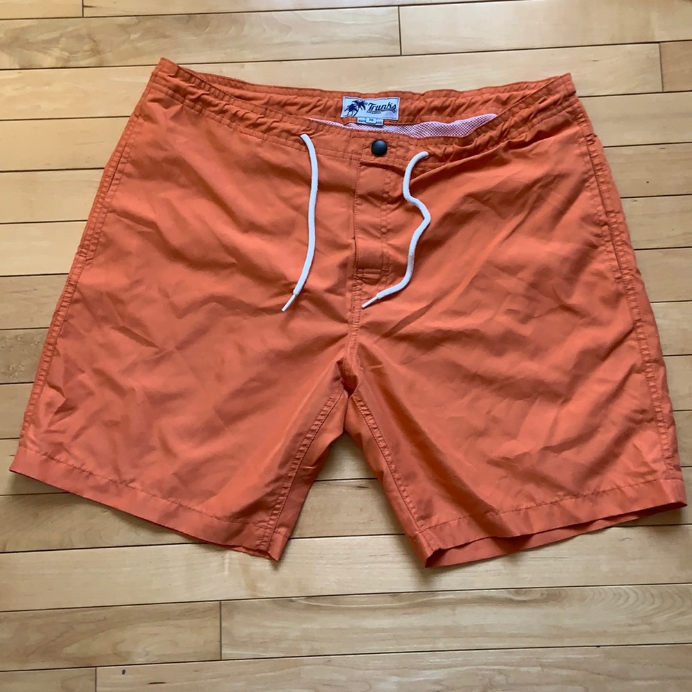 Men’s orange swim trunks, size 36